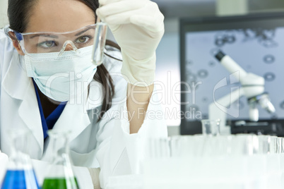 Female Scientist or Woman Doctor With Test Tube In Laboratory