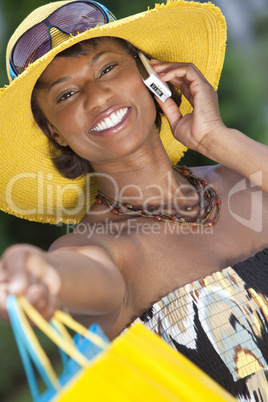 African American Woman With Fashion Shopping Bags on Cell Phone