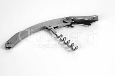 Corkscrew on white table