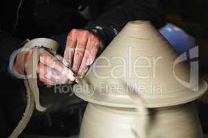 Making a porcelain vase with clay