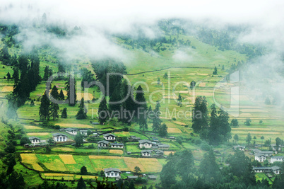 Mountain village in a misty morning
