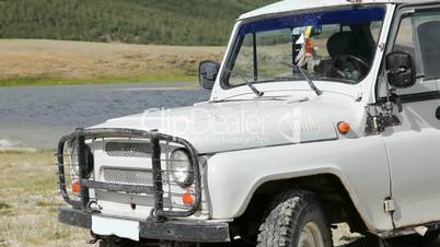 Jeep at coastline of Dayan Nuur lake