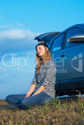 Young Blond Woman With Her Broken Car