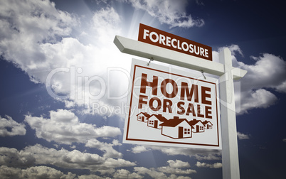White Foreclosure Home For Sale Real Estate Sign Over Clouds and