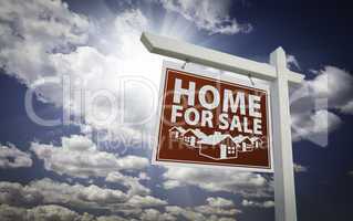 Red Home For Sale Real Estate Sign Over Clouds and Sky