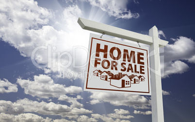 White Home For Sale Real Estate Sign Over Clouds and Sky