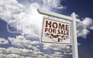White Home For Sale Real Estate Sign Over Clouds and Sky