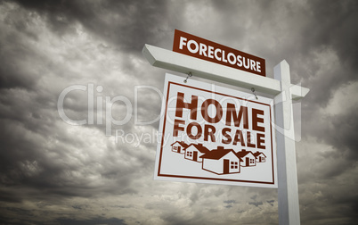 White Foreclosure Home For Sale Real Estate Sign Over Cloudy Sky