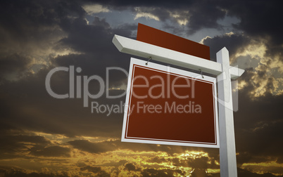 Blank Red Real Estate Sign Over Sunset Sky