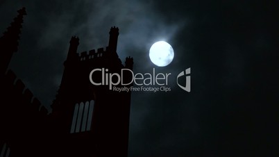 Timelapse full moon over derelict church spire