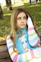 Young woman on a park bench