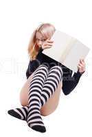 Young girl hide on book