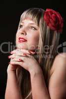 Happy Blond With Red Flower in hair