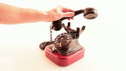 retro phone ringing on white background