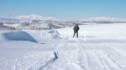 Man on snowy mountain road winter HD 8431