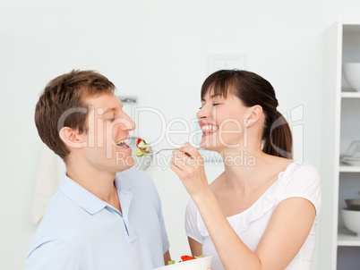 Happy couple eating together