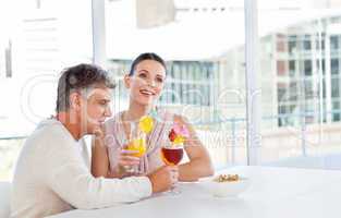 Happy couple drinking a glass