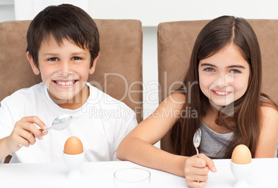 Children having breakfast in the kitchen