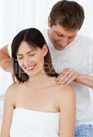 Man giving massage to his wife