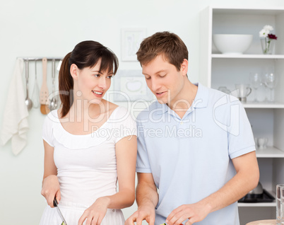 Lovers cooking together in the kitchen