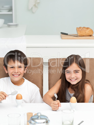 Children having breakfast in the kitchen