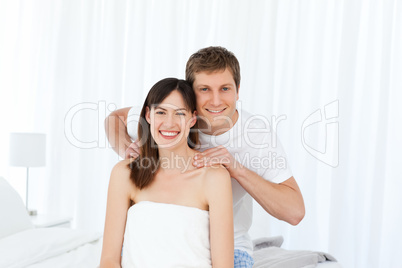 Man giving massage to his wife