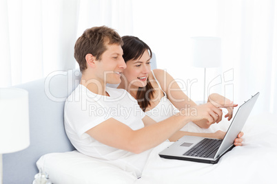Young pairs watching videos on their computer