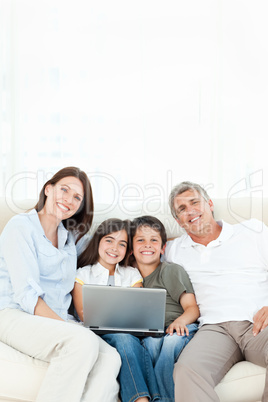 Pretty family looking at the camera at home