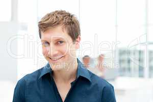 Happy businessman in his office