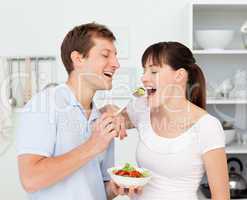 Happy couple eating together