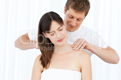 Man giving massage to his wife