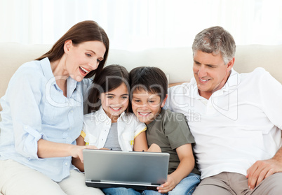 Family looking at  the laptop