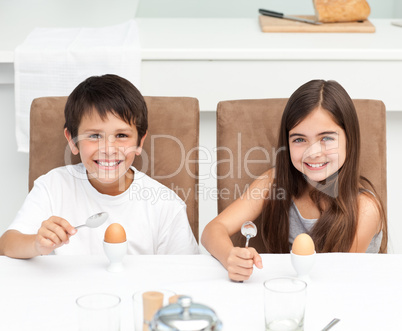 Children having breakfast in the kitchen