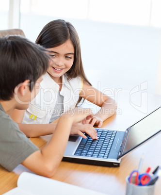 Children working on their laptop at home