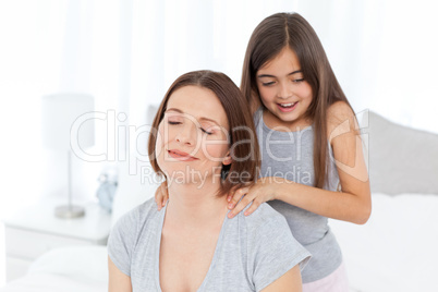 Lovely daughter brushing her woman hair