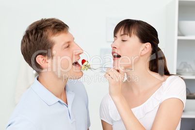 Happy couple eating together