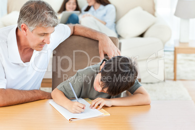 Father helping his son with his homework