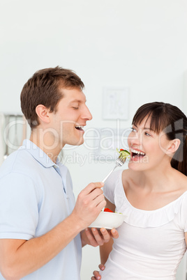 Happy couple eating together