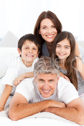 Happy familly looking at the camera