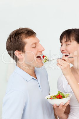 Happy couple eating together