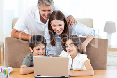 Family looking at the laptop