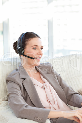 Businesswoman phoning in her living room