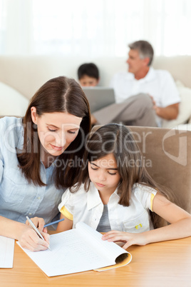 Mother helping her daughter for her homework