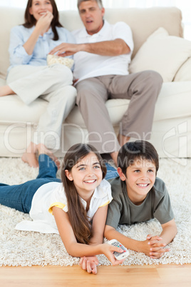 Family watching tv in the living room