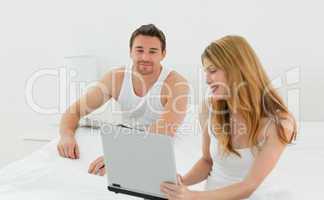 Lovers looking at the laptop