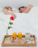 Lovers sleeping after having breakfast