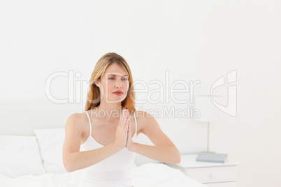 Woman practice yoga on her bed