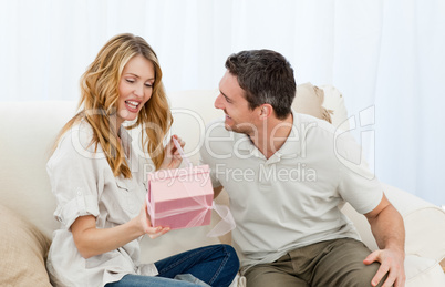 Man offering a gift to his wife