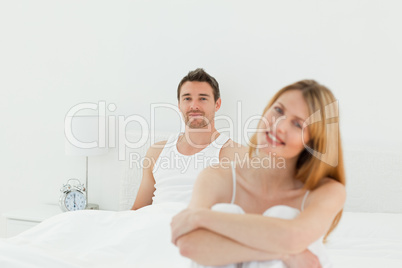 Superb woman looking at the camera with her husband