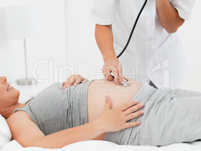 Pregnant woman with a nurse